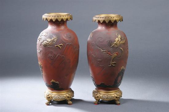 Appraisal: PAIR JAPANESE IRON RED AND GILT PORCELAIN ORMOLU MOUNTED VASES