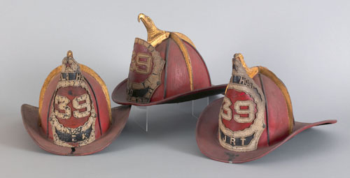 Appraisal: Set of three Tivoli Hose painted leather fireman's helmets dated