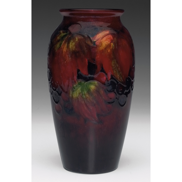 Appraisal: Moorcroft vase rich flambe glaze grape leaf and berry design