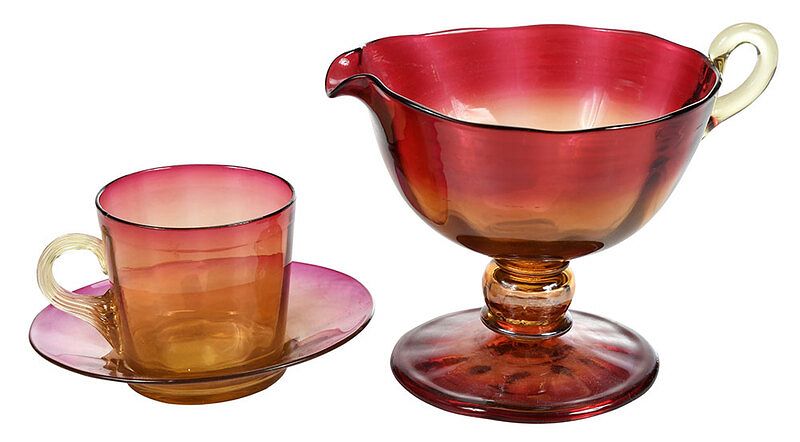 Appraisal: Libbey Amberina Glass Creamer Cup and Saucer American th century