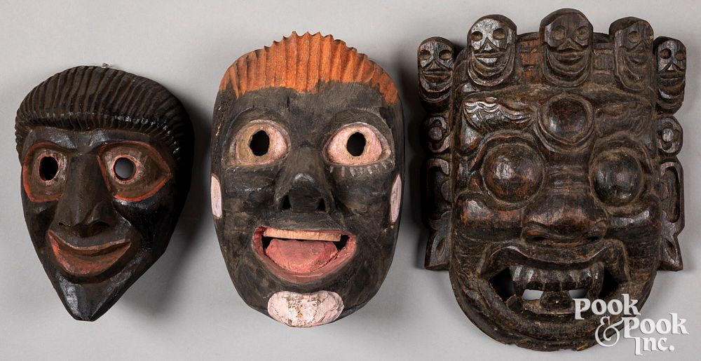 Appraisal: Three Nepalese carved and painted masks Three Nepalese carved and