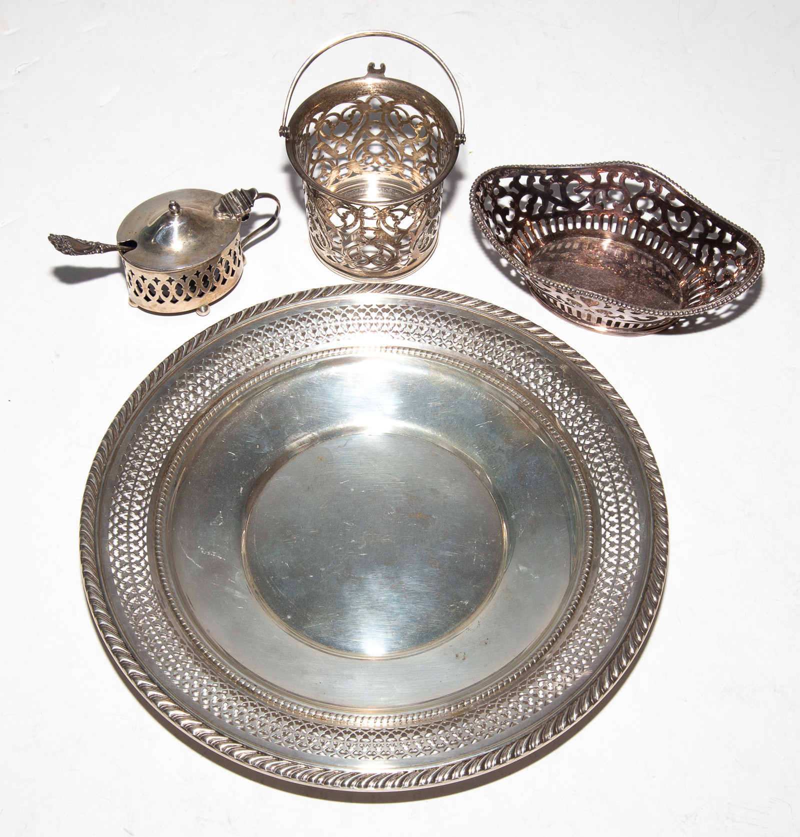 Appraisal: FOUR PIECES PIERCED STERLING TABLEWARE Including a Gorham dish in