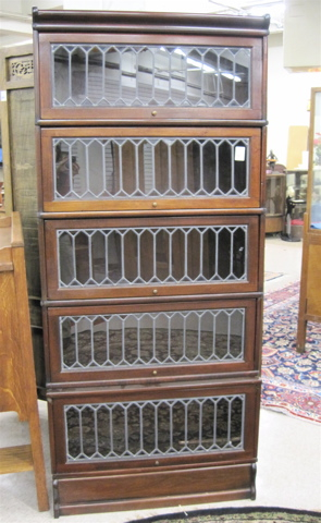 Appraisal: STACKING MAHOGANY AND LEADED GLASS SECTIONAL BOOKCASE attributed to The