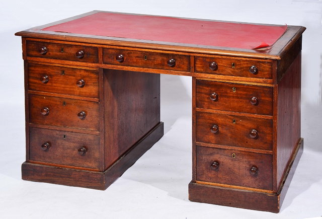 Appraisal: A VICTORIAN MAHOGANY RECTANGULAR PEDESTAL DESK fitted one long and