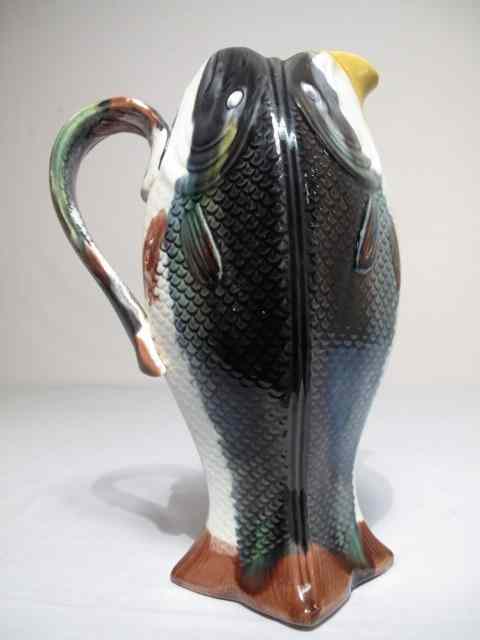 Appraisal: A Majolica pottery pitcher three sided with a gray fish