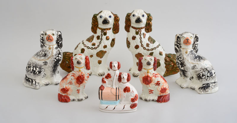 Appraisal: THREE PAIRS OF STAFFORDSHIRE FIGURES OF SPANIELS AND A SPANIEL