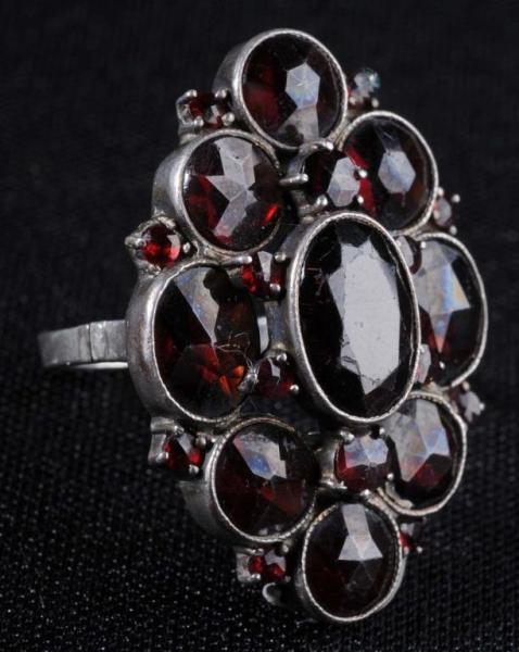 Appraisal: Garnet Silver Ring Description Marked Nine garnets of good color