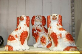 Appraisal: A pair of Staffordshire spaniels and a single spaniel each