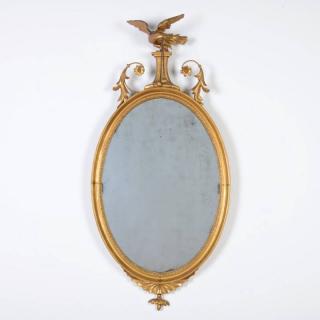 Appraisal: George III oval giltwood wall mirror th th c eagle