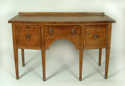 Appraisal: A GEORGE III MAHOGANY SIDEBOARD of bowed form the banded