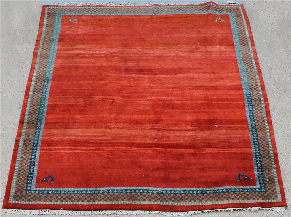 Appraisal: TIBET WOOL RUG WITH BORDER DESIGN brick field with corner