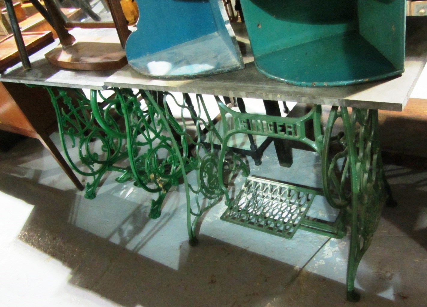 Appraisal: A similar pair of cast iron sewing machine bases with