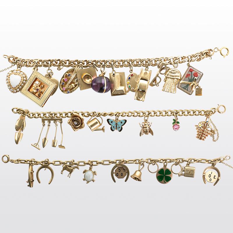 Appraisal: YELLOW GOLD CHARM BRACELETS Condition Report