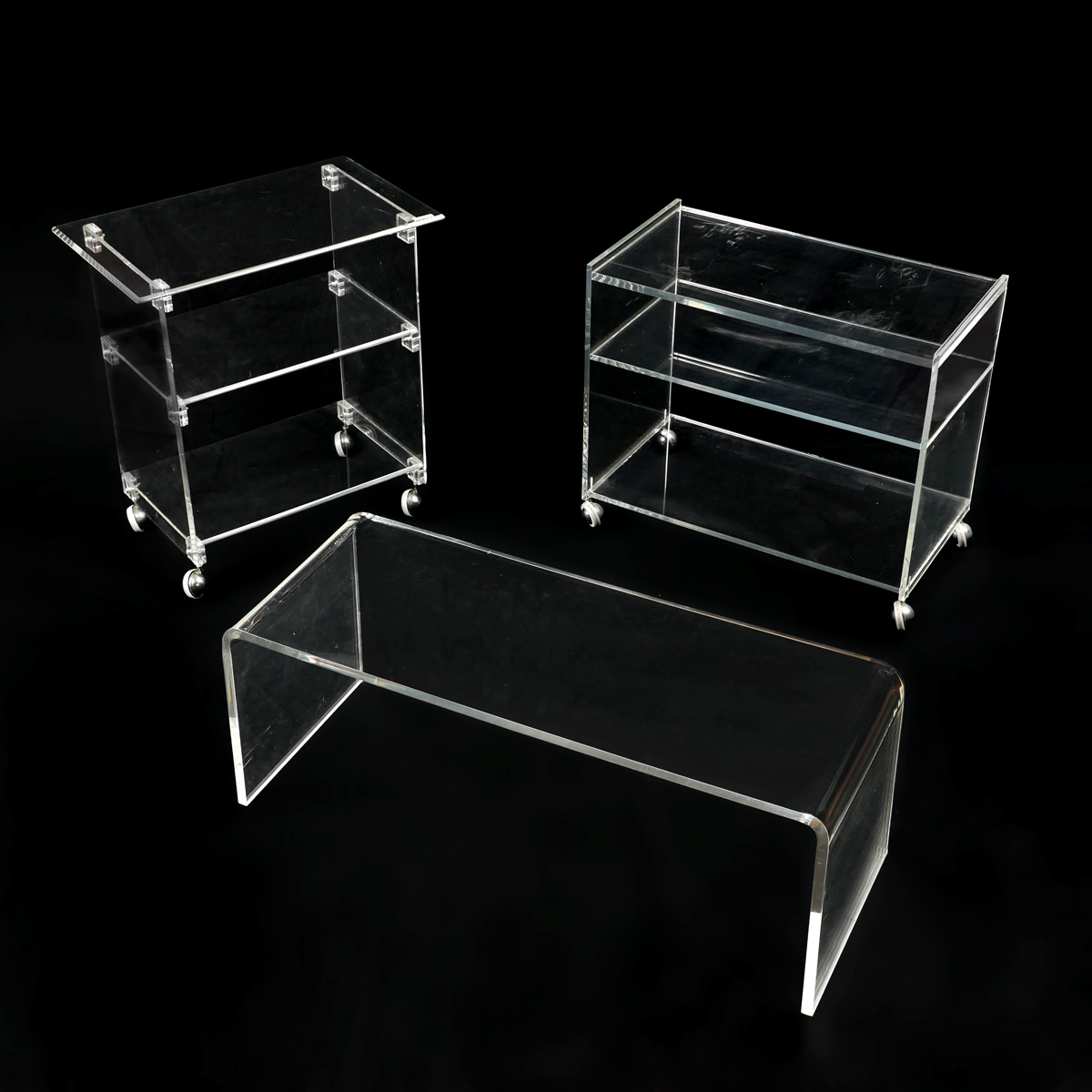 Appraisal: PC LUCITE COFFEE TABLE AND TEA CARTS Comprising - Lucite