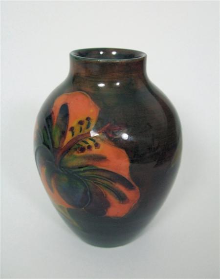 Appraisal: MOORCROFT MINIATURE FLAMBE OVOID VASE CIRCA glazed earthenware tube line