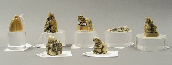 Appraisal: A group of seven ivory netsuke Including four carvings of