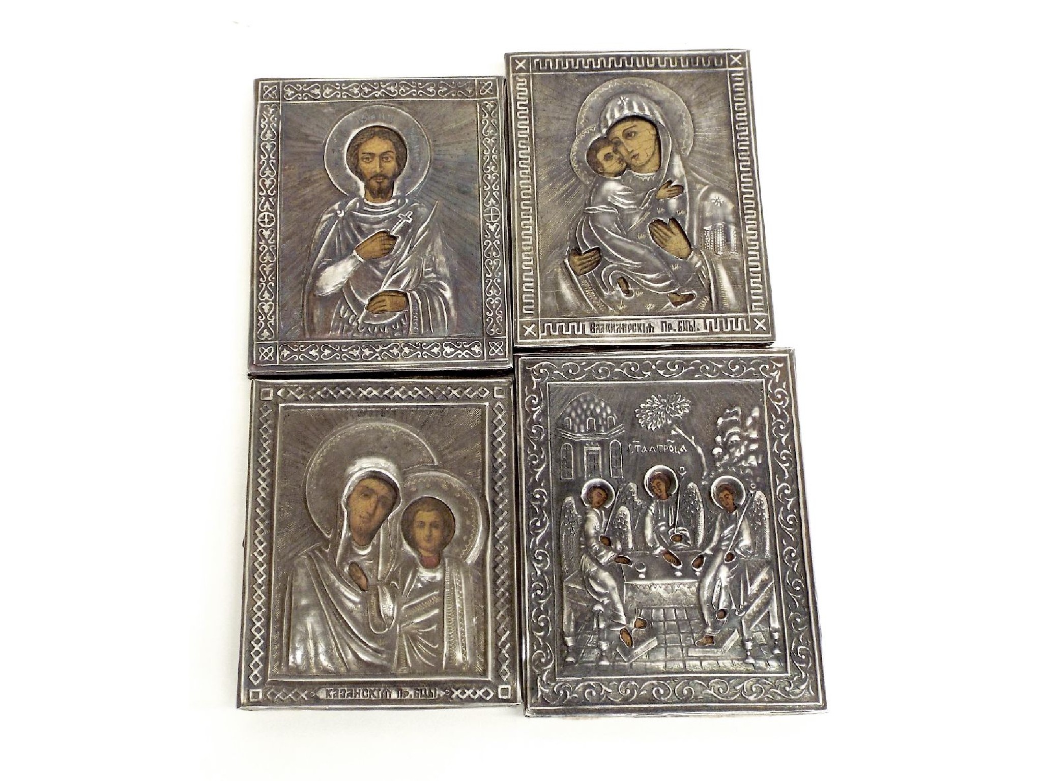 Appraisal: Collection of four white metal bound Russian type religious icons