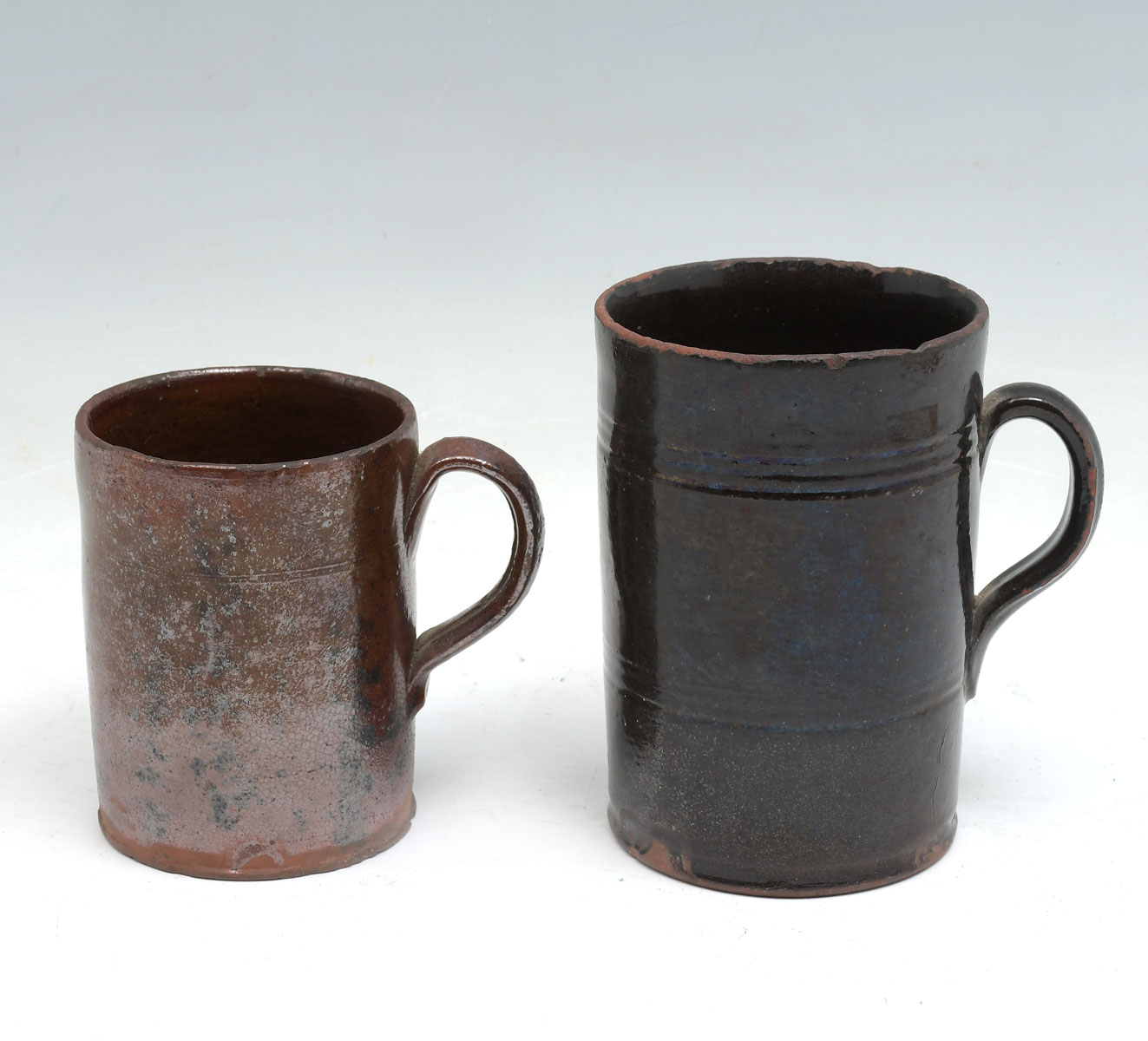 Appraisal: PC TH CENTURY REDWARE MUGS - Redware mugs having incised