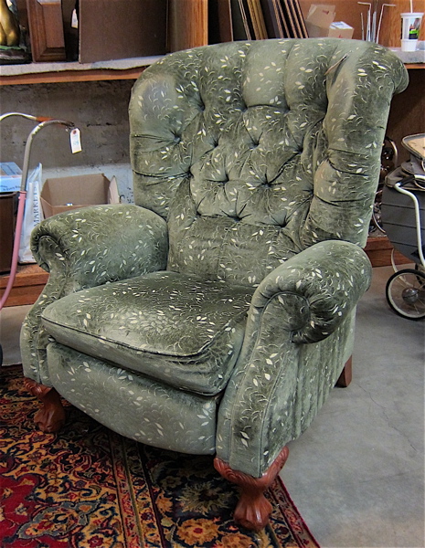 Appraisal: GREEN RECLINING EASY CHAIR with overall green upholstery over carved