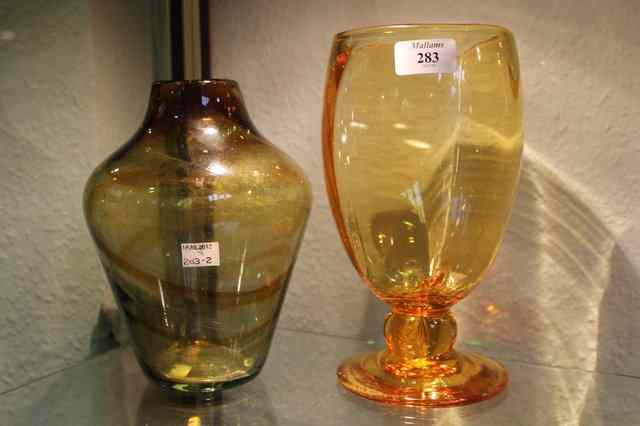 Appraisal: A WHITEFRIARS AMBER OPTIC RIBBED FOOTED GLASS VASE circa designed