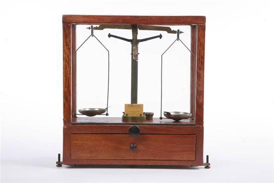 Appraisal: SET OF SCALES Manufactured by Voland Sons In an oak