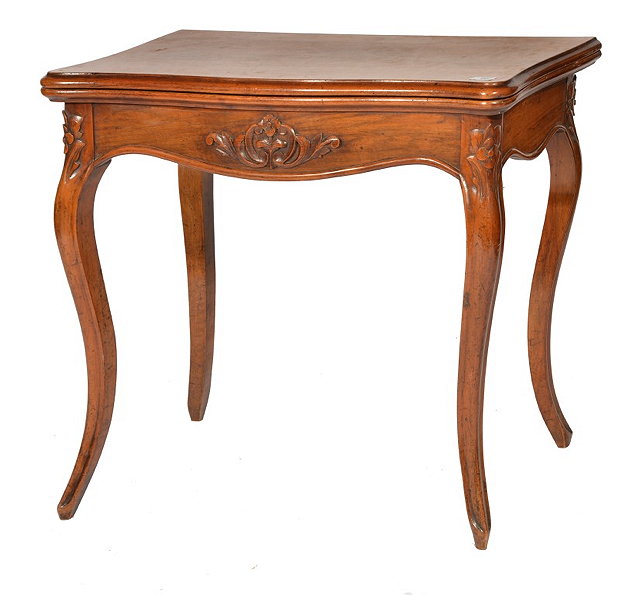 Appraisal: A ROSEWOOD FOLD-OVER CARD TABLE with shaped top and carved