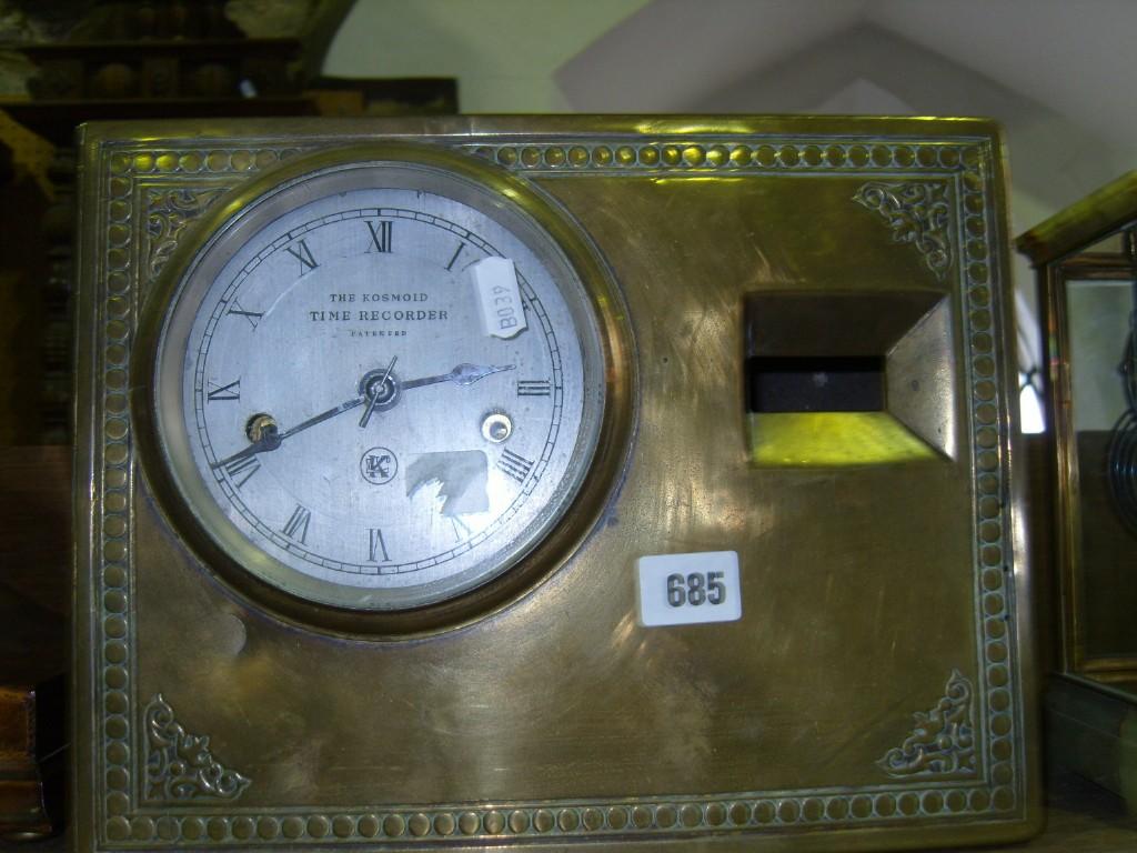 Appraisal: A Kosmoid time recorder and a brass fronted case