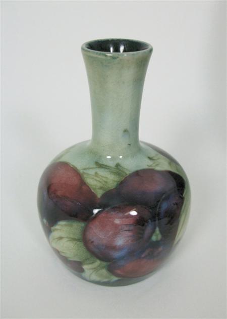 Appraisal: MOORCROFT MINIATURE BOTTLE VASE CIRCA glazed earthenware tube line decoration