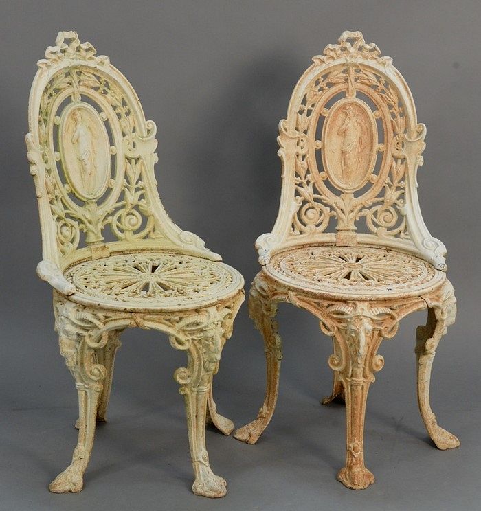 Appraisal: Pair iron outdoor chairs with medallion backs and rams head