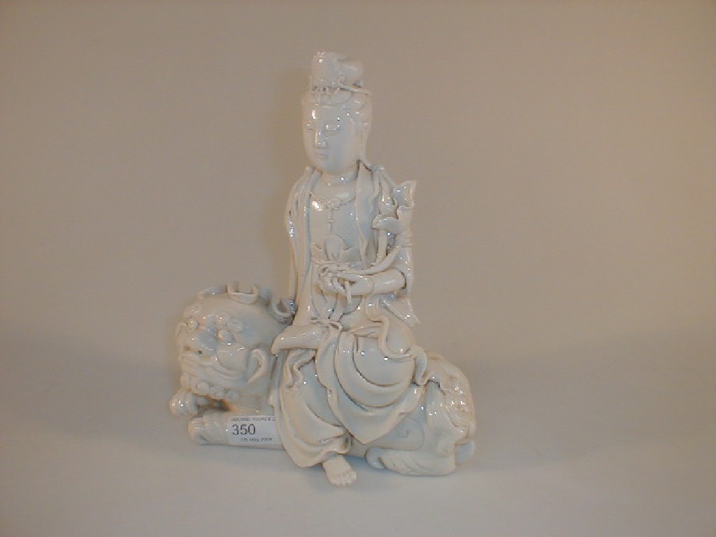 Appraisal: A Chinese blanc-de-chine figure of a deity seated upon a