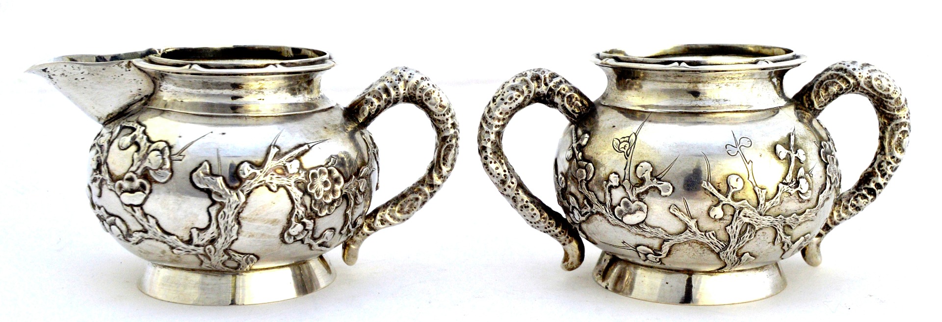 Appraisal: An Oriental twin handled sugar bowl and a matching milk