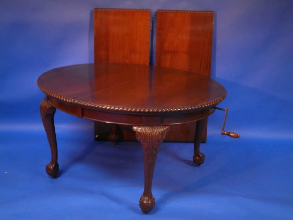 Appraisal: An early thC mahogany extending D end dining table carved