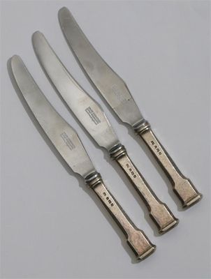 Appraisal: Three Omar Ramsden silver table knives with simple champfered and