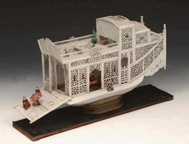 Appraisal: A CARVED IVORY CANTONESE MODEL OF A BOAT with figures