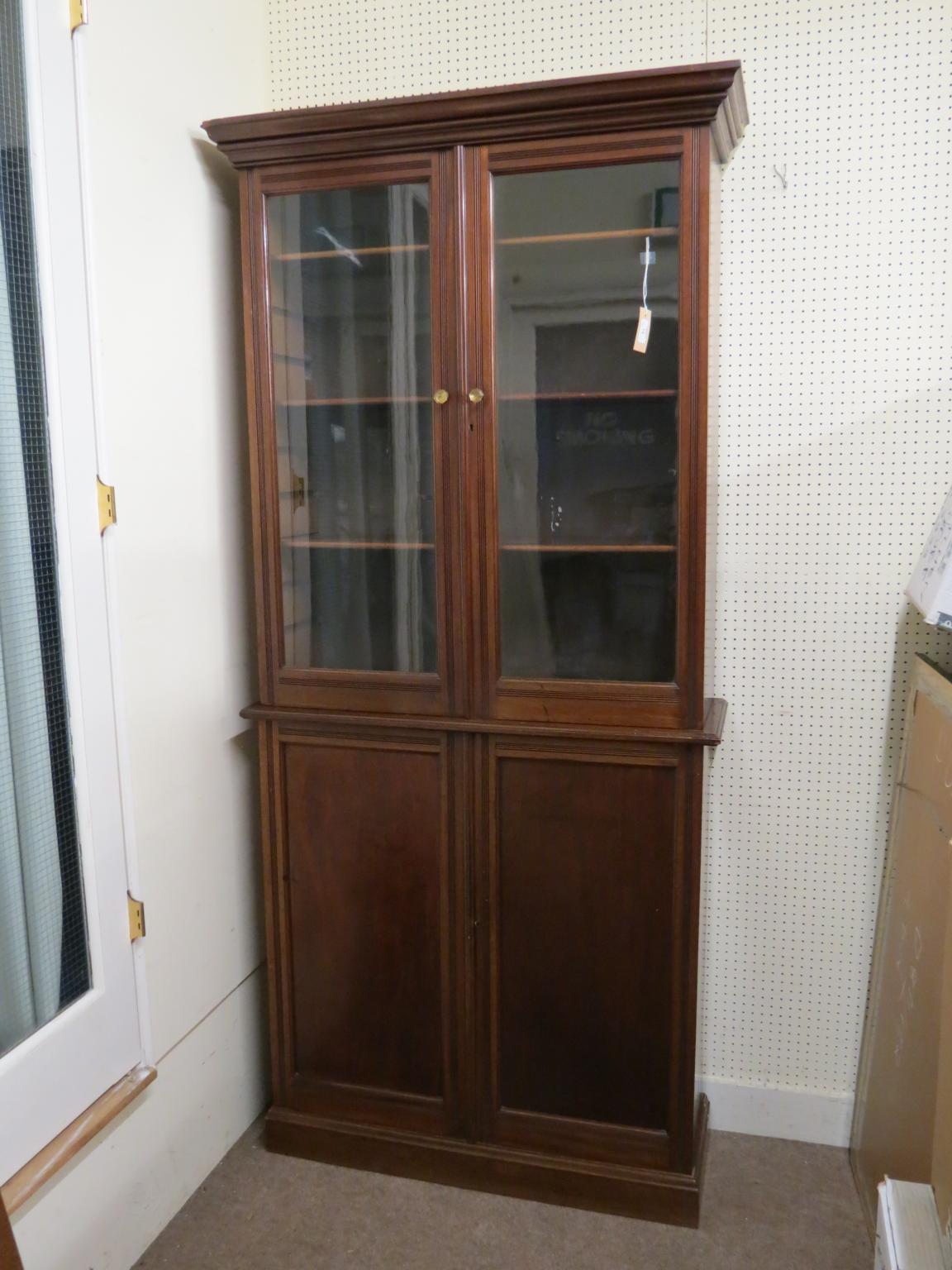 Appraisal: A Victorian walnut tall bookcase upper stage with three adjustable