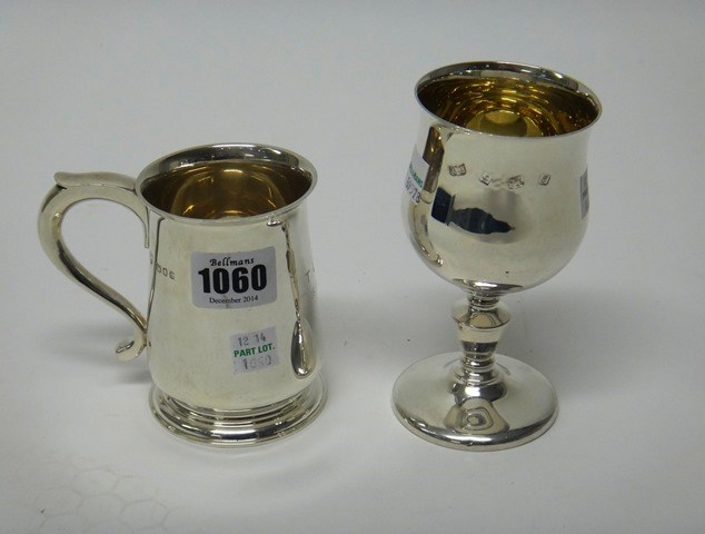 Appraisal: A silver christening mug of tapered form with a scrolling