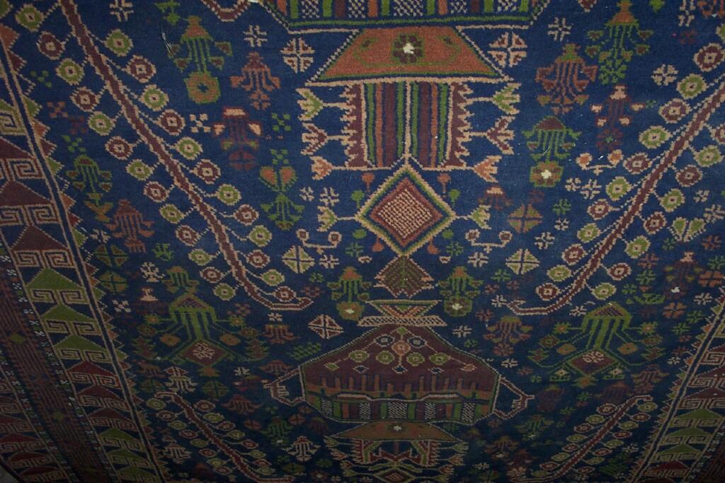 Appraisal: A blue ground wool rug in the Eastern style with