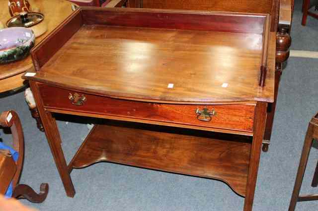 Appraisal: A MAHOGANY BOW FRONTED WASH STAND the low raised back