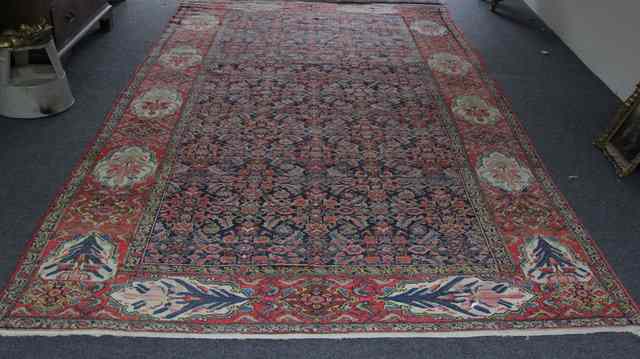 Appraisal: An Oriental rug serrated leaf and flower head design on