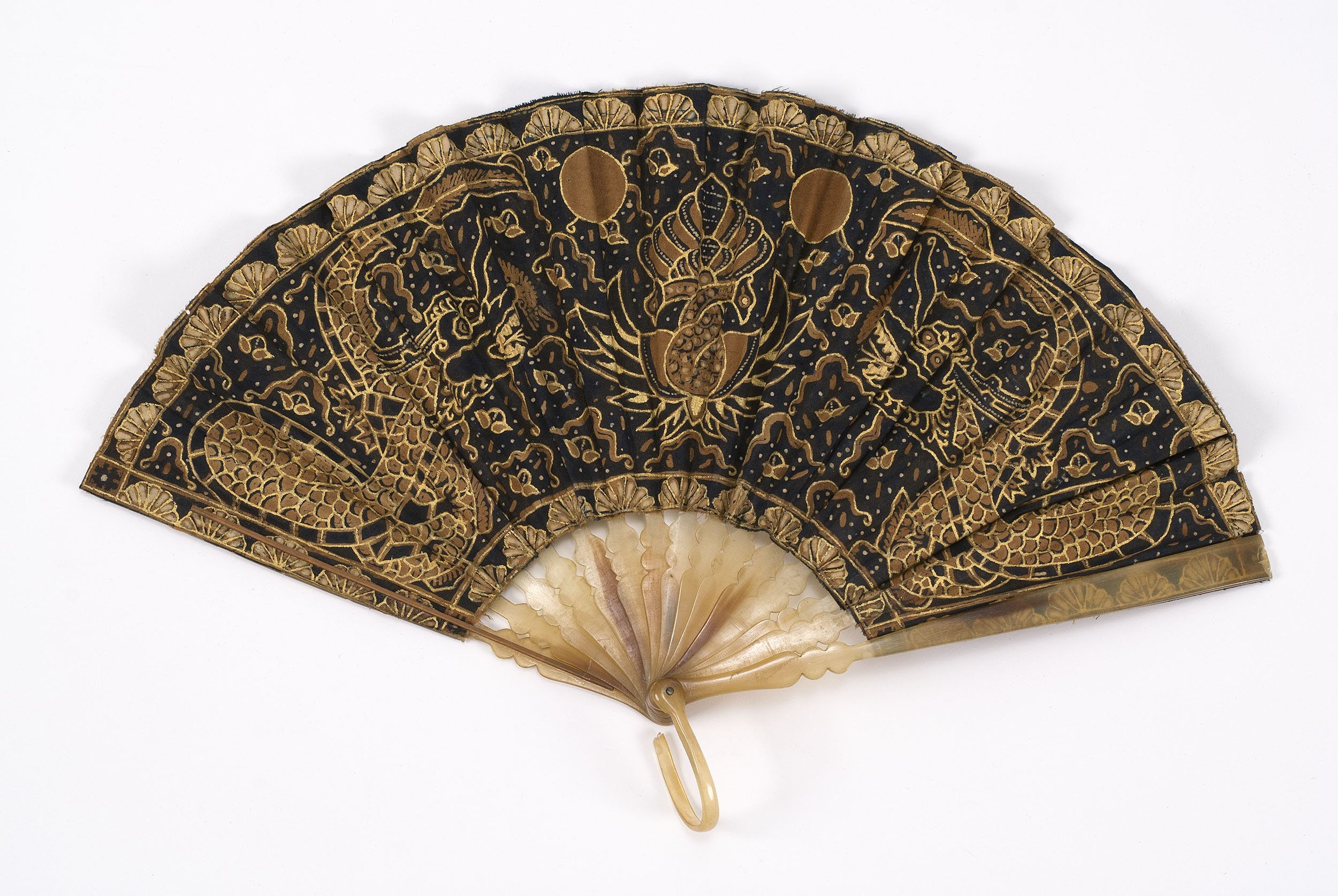 Appraisal: BATIK AND HORN FOLDING FAN Indonesian th CenturyLeaf of batik