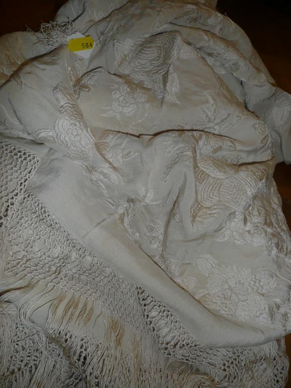 Appraisal: A vintage cream silk embroidered shawl with flower detail