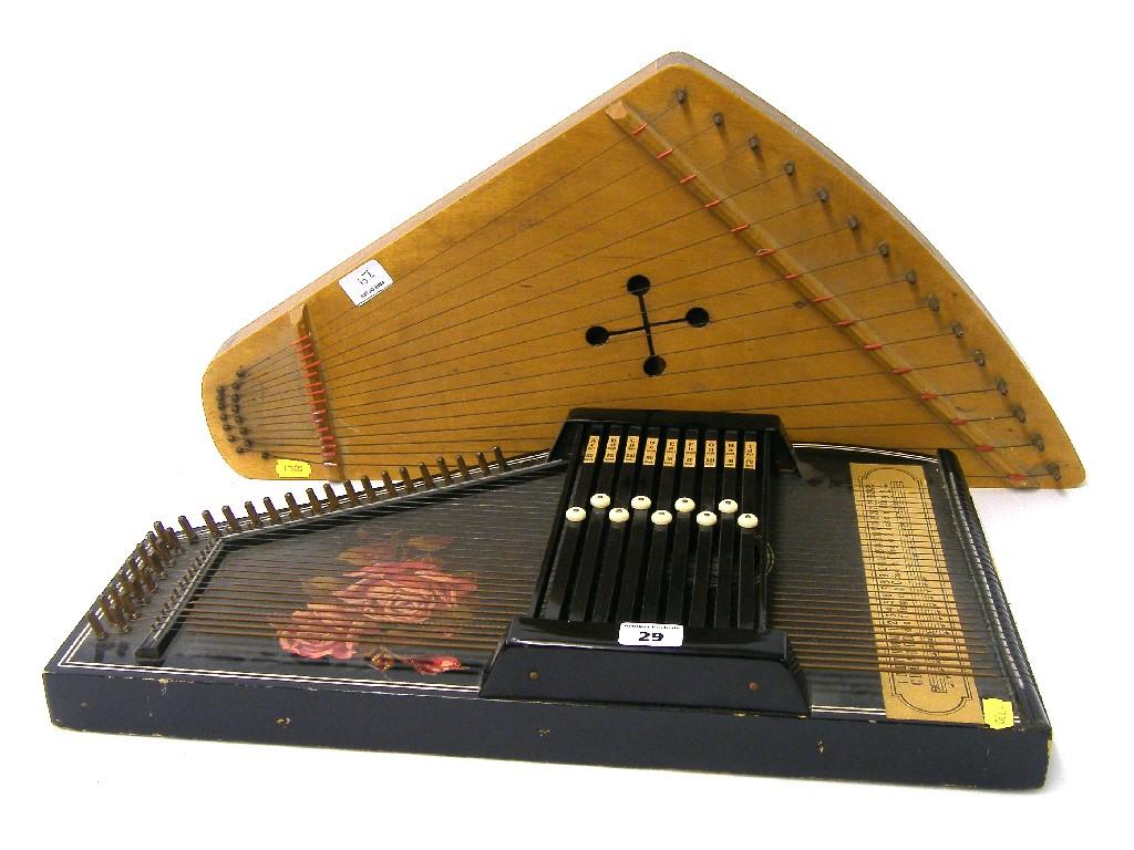 Appraisal: German ebonised auto harp together with a Finnish Kantele