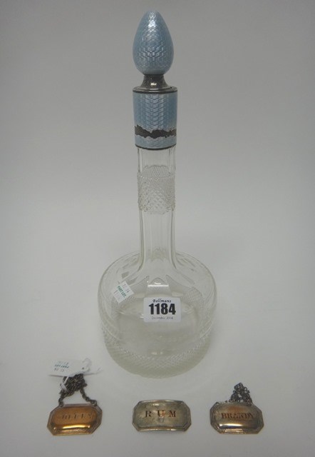 Appraisal: A silver and pale blue enamel mounted faceted glass decanter