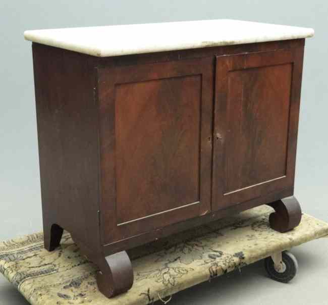 Appraisal: th c Empire two door marble top cabinet case rests