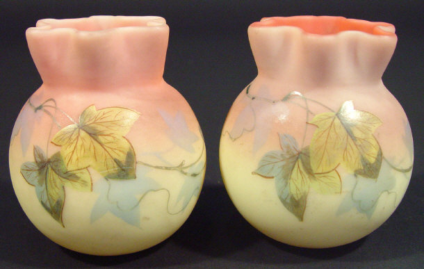 Appraisal: Two Burmese glass pots with fluted necks decorated with leaves