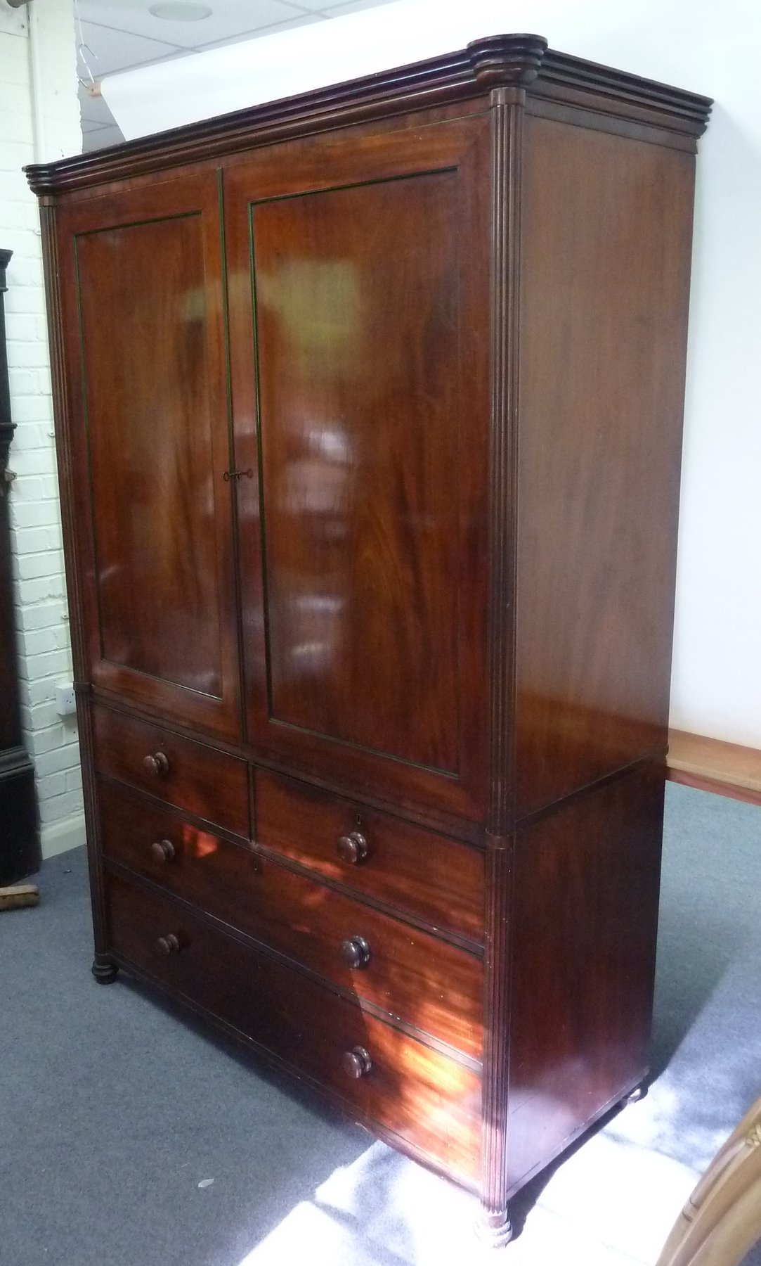 Appraisal: An early th Century mahogany linen press with moulded cornice