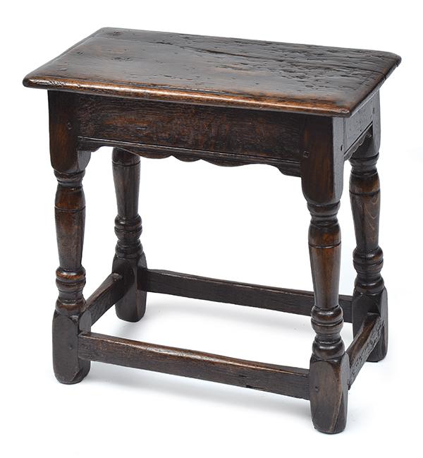 Appraisal: A GEORGE III OAK JOINED STOOL raised on turned legs