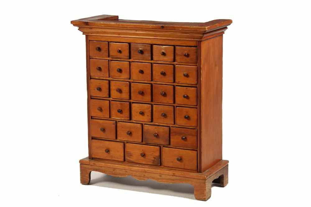 Appraisal: SPICE CABINET - Pumpkin Pine Twenty-Seven Drawer Country Spice Cabinet