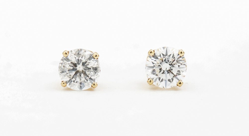 Appraisal: DIAMOND STUD EARRINGS Two round brilliant cut diamonds in K