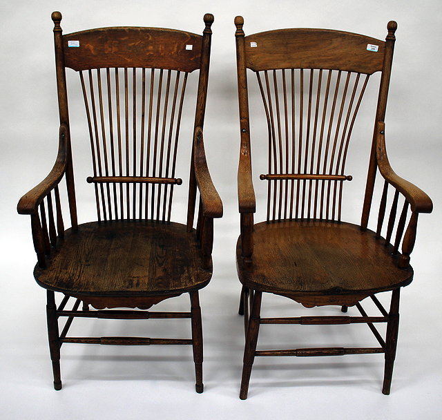 Appraisal: A PAIR OF POSSIBLY AMERICAN OAK SPINDLE BACK OPEN ARMCHAIRS